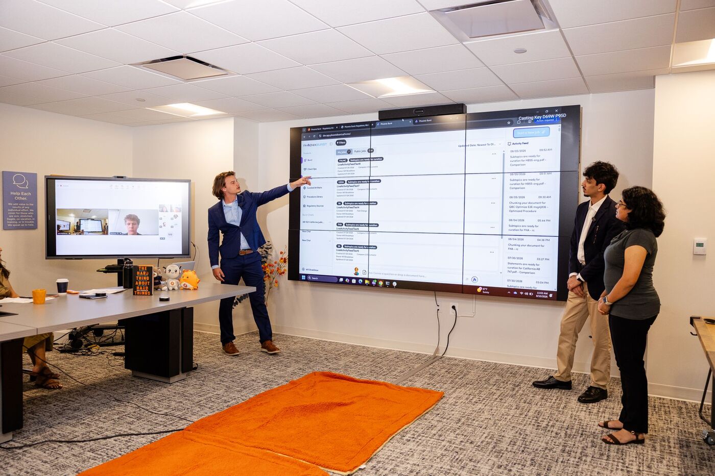 A presenter points to a live Phoenix Burst screen during a demo